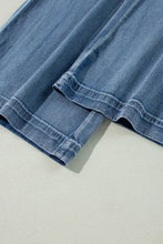 High-waisted wide-leg jeans in blue denim with a classic slightly faded wash and neatly stitched hems