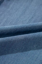 High-waisted wide-leg jeans in blue denim with soft worn texture and subtle stitching details