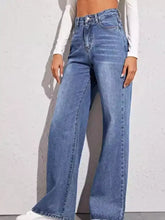 High-waisted blue denim wide leg jeans with five-pocket design and subtle fading for a classic worn-in look