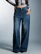 Dark blue high waisted wide leg jeans in denim with classic five pocket design and wide leg fit