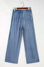 Light blue denim high-waisted wide-leg jeans with an elastic waistband for comfortable casual wear
