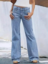 Light-wash denim high-waisted wide leg jeans with frayed hems featuring a wide-leg jeans silhouette