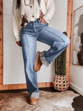 High-waisted wide leg jeans in light-wash denim with rolled cuffs and classic five-pocket design fabric blend