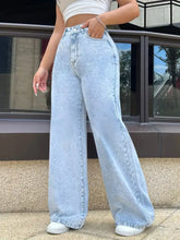 High-waisted wide leg jeans in light-wash denim featuring a high-rise fit and wide leg silhouette