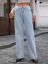 Light-wash denim high-waisted wide-leg jeans showcasing a relaxed fit and vintage-inspired style