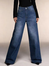 High-waisted wide leg jeans in medium blue denim with classic stitching and button closure
