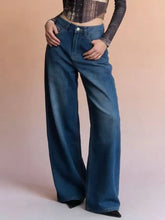 High-waisted wide leg jeans in medium blue denim with classic stitching and button closure wide leg jeans