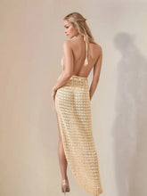 Backless halter neck knit dress with high slit and slight stretch