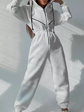 White hooded zip-up long sleeve jumpsuit with black drawstrings