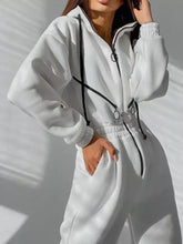 White long sleeve jumpsuit with zip-up hoodie and matching pants