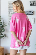 Woman in HOPELY star pattern oversized waffle T-shirt with white shorts