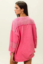 Bright pink high-low washed t-shirt with textured details for women