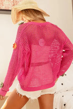 Hot pink open knit sweater cardigan with Bibi flower patches