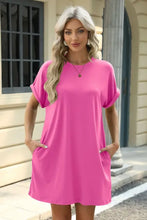Hot pink t-shirt dress with pockets, round neckline, machine wash cold