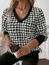 Black and white houndstooth v neck buttoned cuffs sweater