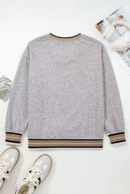 Howdy graphic v-neck sweatshirt in gray heathered fabric with beige black white striped ribbed cuffs and hem machine wash cold