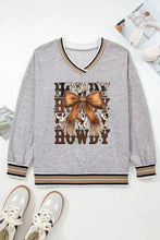 Gray long-sleeved v-neck sweatshirt with brown bow and howdy text graphic, machine wash cold recommended