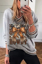 Gray howdy graphic v-neck sweatshirt with tan leather bow and fringe detail, machine wash cold recommended