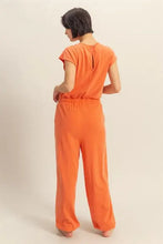 Back view of HYFVE keyhole round neck cap sleeve orange jumpsuit
