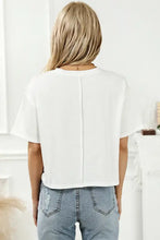 Womens white short-sleeve crop top with back seam in IN DOLLY WE TRUST round neck design