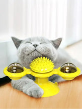 Bright yellow rotating cat toy with suction cup, spiky ball and bell arms