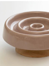 Interactive slow feeder pet bowl in beige ceramic with ridges and wood base