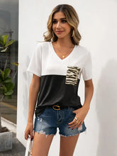 Ivy Lane color block short sleeve tee with black and white V-neck and tiger print pocket