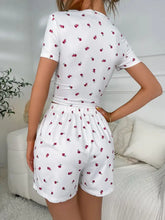 Ivy Lane floral ruched t-shirt and shorts lounge set in white with short sleeve length and red cherry print