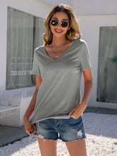 Woman in Ivy Lane Lace short sleeve V-neck T-shirt and denim shorts
