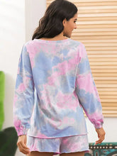 Ivy Lane tie-dye long sleeve top in pastel pink and blue with elastic cuffs and sleeve length for comfortable loungewear