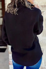 Black johnny collar long sleeve sweatshirt over blue jeans