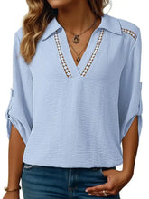 Light blue textured cotton johnny collar texture blouse with v-neck and decorative brown lace trim along the collar