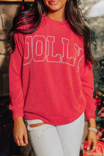 A cozy red ribbed knit jolly textured christmas sweatshirt with bold white lettering made of slightly stretchy material
