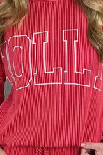 Red corduroy jolly textured christmas sweatshirt with white outlined roll lettering and slightly stretchy material