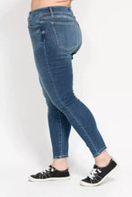 Judy Blue high rise skinny jeans in classic medium blue denim with slim fit frayed hems and subtle fading