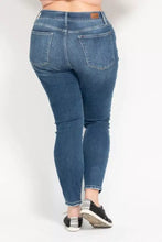 Blue denim judy blue skinny jeans with a high rise button fly and frayed cuffs in a classic fit plus size style
