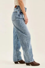 Judy Blue light-wash denim arc leg jeans with high-rise wide-leg cut and brown leather belt loop plus size full size