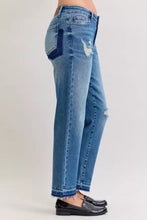 Mid-wash blue judy blue plus size mid rise denim jeans with distressed knee and frayed hem