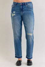 Judy Blue plus size mid rise denim jeans in medium wash blue with distressing and frayed hems