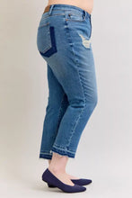 Back view of judy blue plus size mid rise mid-wash blue denim jeans with distressed patch and frayed cuffs