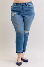 Mid rise cropped denim jeans in medium blue wash with distressed patches and frayed hems by judy blue plus size