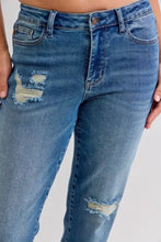 Plus size judy blue mid rise blue denim jeans with distressed frayed patches on thighs and knees
