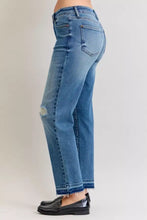 Medium-wash blue denim judy blue plus size mid rise jeans with distressed knee patch and frayed hem full size fit