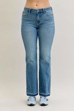 Light-wash denim judy blue slim bootcut jeans with mid rise, frayed hems, and classic five-pocket design
