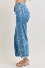 Judy Blue high rise ankle wide leg jeans in blue denim with faded distressed pattern and frayed hems core principle design