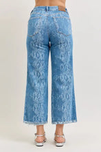 Judy Blue high rise ankle wide leg blue denim jeans with snakeskin pattern and frayed cuffs embody the core principle