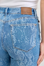 Blue denim judy blue high rise ankle wide leg jeans with snakeskin pattern and brown leather brand patch core principle