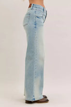 Light-wash judy blue column straight jeans with classic five-pocket design and brown leather waistband