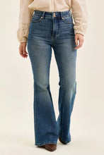 Blue denim flare jeans with high waist double button tummy control and classic five-pocket design from judy blue