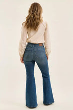 Blue denim flare jeans with classic five-pocket design and brown leather belt loop judy blue high waist flare jeans